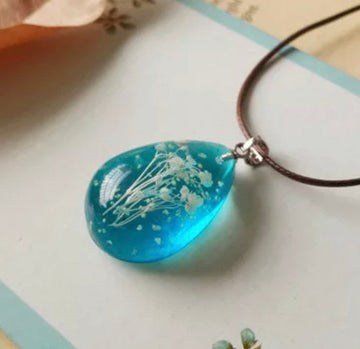 Real Flowers Pendant Necklace Encased in Resin that Glows in the Dark